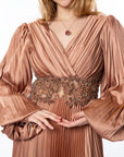 Elegant Bronze Pleated Maxi Dress with Beaded Waist Detail